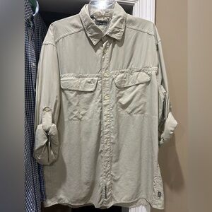 REI Tan Outdoor Shirt with lots of pockets and breathable fabric